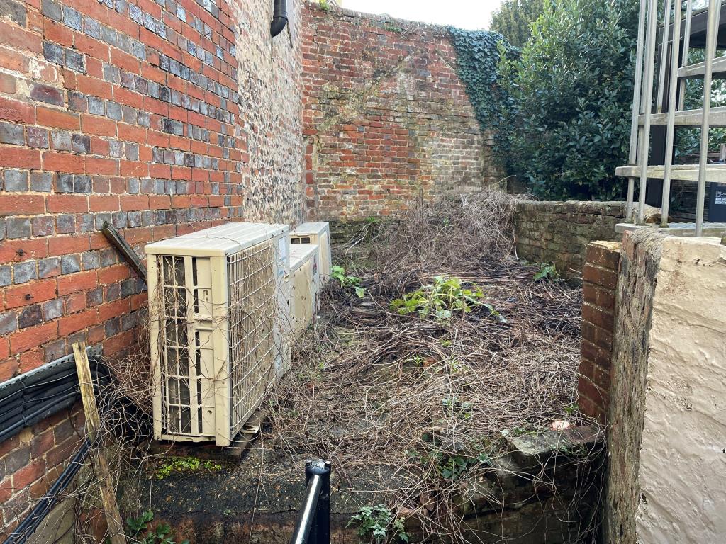 Lot: 21 - PERIOD MIXED USE PROPERTY WITH RESIDENTIAL CONSENT FOR A FOUR-BEDROOM TOWN HOUSE - View of walled rear south facing patio